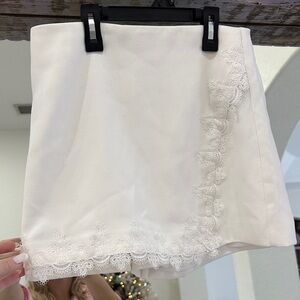 Revolve NBD white skort with lace trim